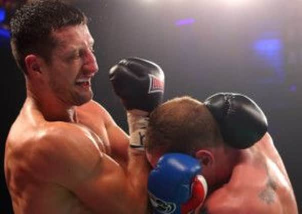 George Groves (right) and Carl Froch during the WBA and IBF Super Middleweight Title fight. Picture: PA