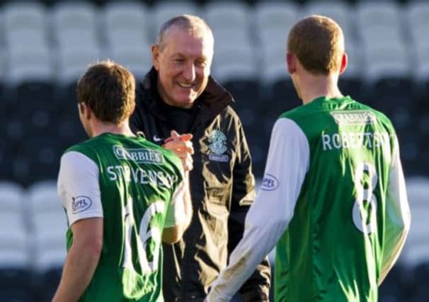 Terry Butcher congratulates Lewis Stevenson, left, and Scott Robertson, right, after the draw against St Mirren. Picture: SNS