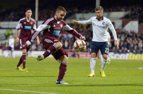 Hearts midfielder Scott Robinson attempts a shot during the 22 draw with Ross County on Saturday. Picture: Phil Wilkinson