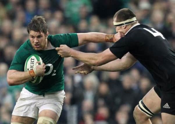 New Zealand lock Luke Romano tackles Ireland flanker Sean O'Brien. Picture: Getty