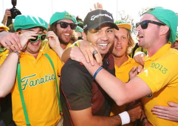 Home hero Jason Day celebrates his win with the Aussie 'Fanatics' at the World Cup of Golf at Royal Melbourne. Picture: Getty