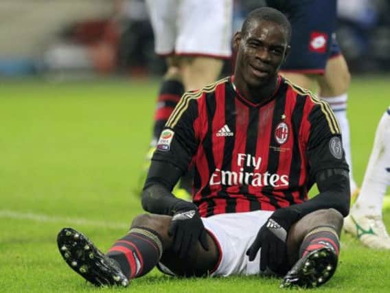 Mario Balotelli reflects the frustrations of his struggling team as AC Milan toiled to a 11 draw with Genoa on Saturday. Picture: Reuters