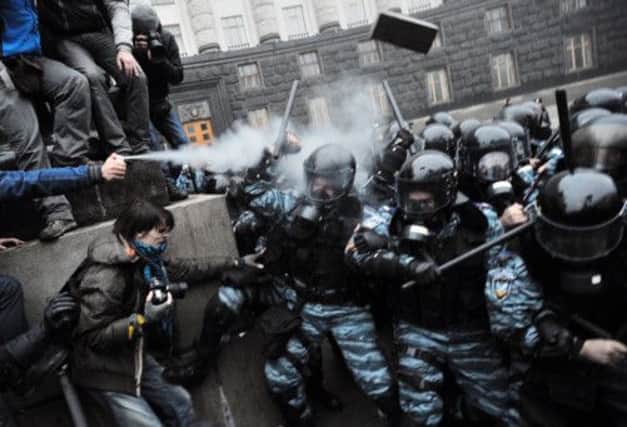 Protesters used tear gas and stones against riot police in a big demonstration in central Kiev yesterday. Picture: Getty