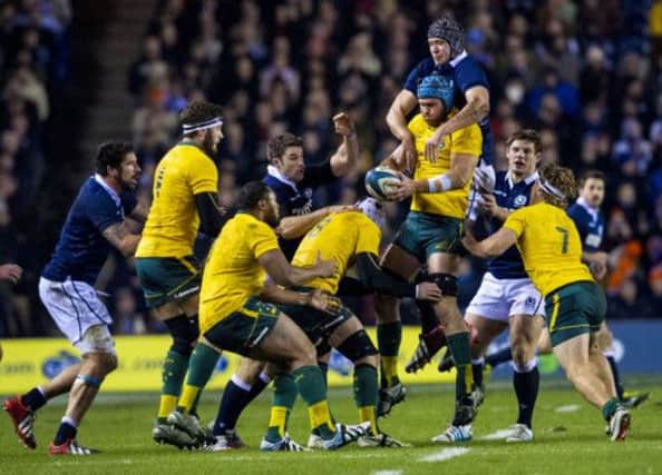 Both sets of players rise for the line out with Australia's James Horwill (3rd from right) coming out on top. Picture: SNS