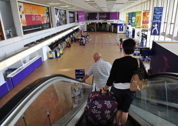Passengers in Preswtick Airport, which has been bought by the Scottish Government for one pound. Picture: Robert Perry