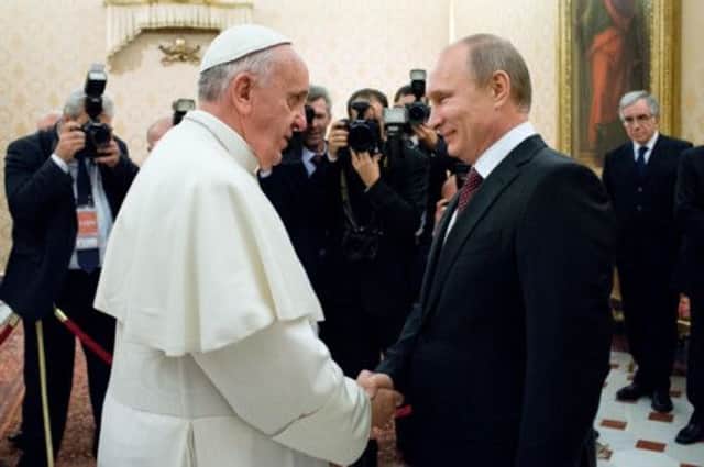 Vladimir Putin meets Pope Francis yesterday on his trip to Rome. Picture: AFP/Getty