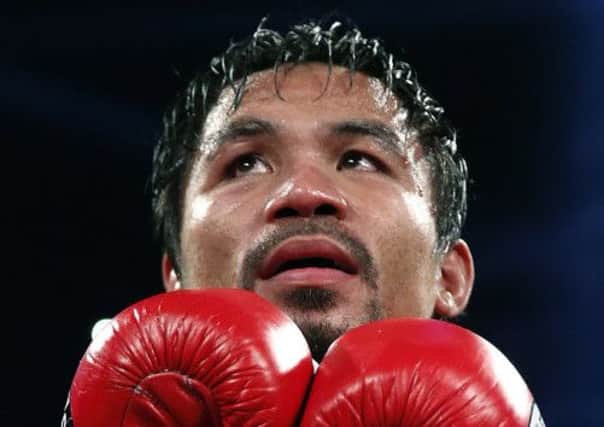 Manny Pacquiao promised cash for typhoon victims but says his accounts are frozen. Picture: Vincent Yu/AP