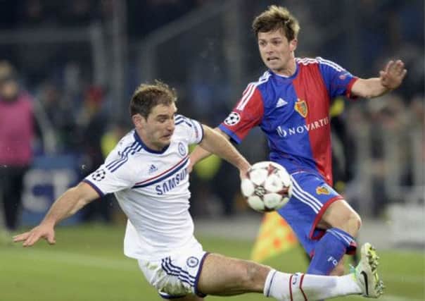 Chelsea's Branislav Ivanovic, left, fights for the ball against FC Basel's Valentin Stocker. Picture: AP