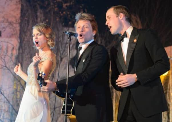 Taylor Swift, Jon Bon Jovi and Prince William, Duke of Cambridge sing on stage at the Centrepoint Gala. Picture: Getty