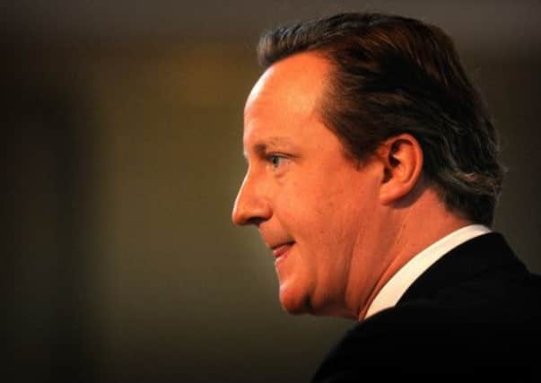 David Cameron has vowed to cut off support for Romanians and Bulgarians, and to deport homeless migrants. Picture: TSPL
