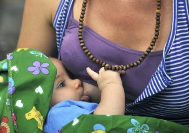More support for breastfeeding at home is needed, say experts. Picture: AFP/Getty