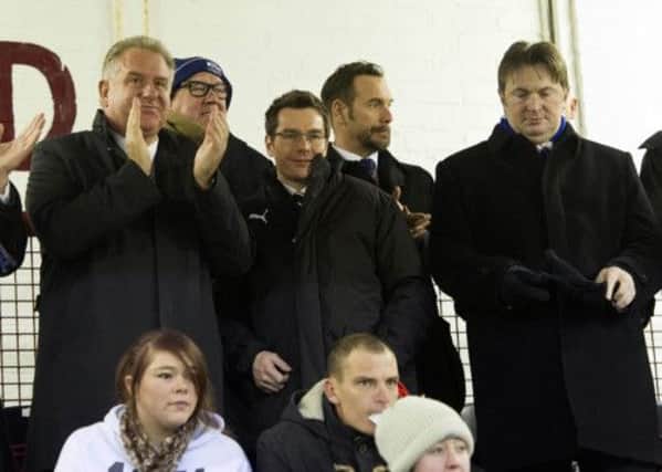 Rangers finance director Brian Stockbridge, third from right, has been attacked over his performance and his personal conduct. Picture: SNS