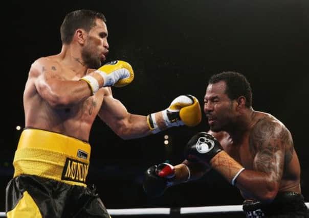 Anthony Mundine lands a left on Shane Mosley. Picture: Getty Images