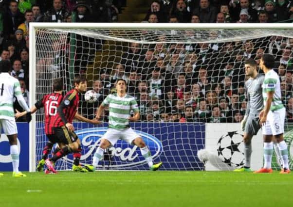 Kaka scores the opening goal as the Celtic defence look on. Picture Robert Perry