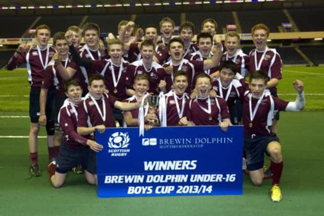 George Watson's U16 players celebrate winning the Brewin Dolphin Scottish Schools trophy. Picture: SNS