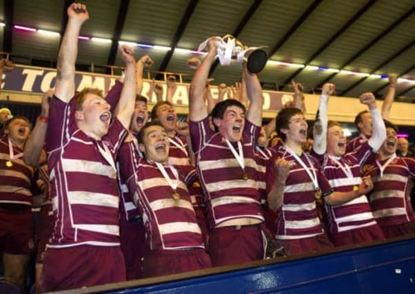 George Watson U18 players celebrate winning the Brewin Dolphin Scottish Schools Cup. Picture: SNS