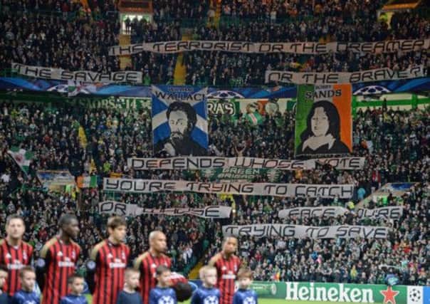 Banners displayed by Celtic fans before their side's Champions League match against Milan. Picture: Getty
