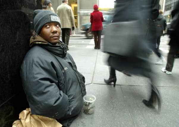 Beggars are to be found in most major western cities, such as this legless man on the streets of New York. Picture: Getty