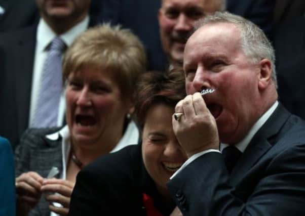 Health Secretary Alex Neil, right, with Ruth Davidson. Picture: PA
