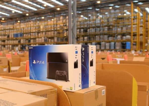 Playstation 4 consoles waiting to be sent from an Amazon warehouse. The console launched today. Picture: Getty