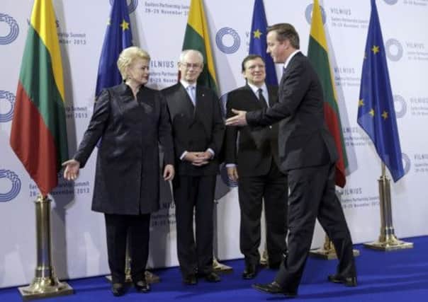 Dalia Grybauskaite, left, Herman van Rompuy and Jose Manuel Barroso welcome Mr Cameron in Vilnius. Picture: Reuters