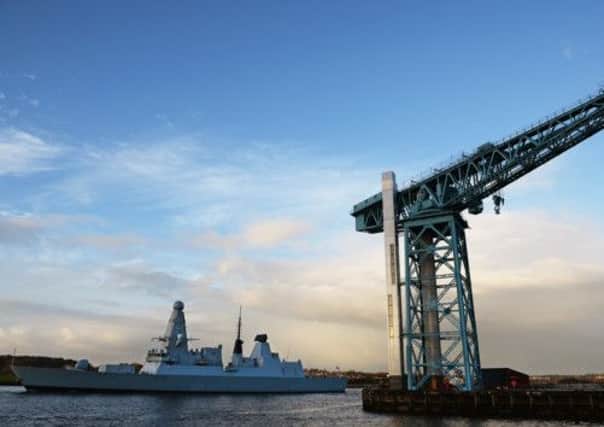 HMS Defender makes its way up the River Clyde. Picture: Getty