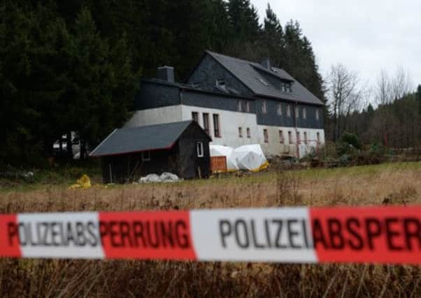 Police officers search the grounds of Detlev Gs home in Saxony. Picture: AP