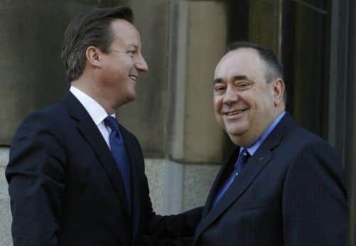 Prime Minister David Cameron  is greeted by Scotland's First Minister Alex Salmond on the steps of St Andrews House