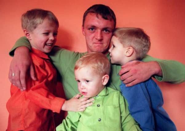 Steven Fulton with his three sons in 1998. Picture: Robert Perry