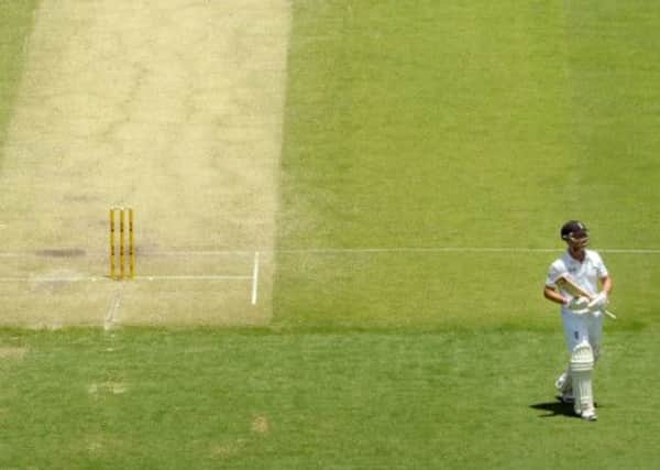 Jonathan Trott leaves the field after losing his wicket to the bowling of Australias Mitchell Johnson. Picture: PA