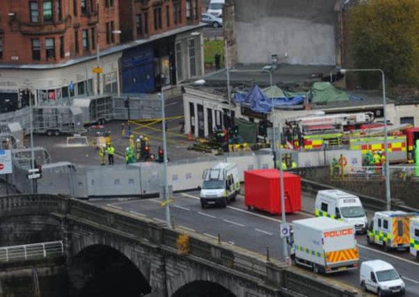 Rescue workers seal off the area around the Clutha Vaults bar by the River Clyde. Picture: Robert Perry