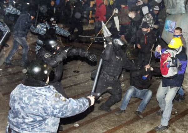 Many protesters were injured in clashes with police on Independence Square in Kiev early yesterday. Picture: AFP/Getty