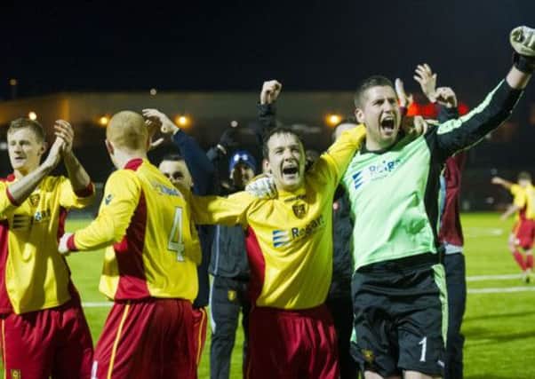 Albion Rovers keeper Neil Parry (right) and Scott Chaplain celebrate the upset of the round. Picture: SNS