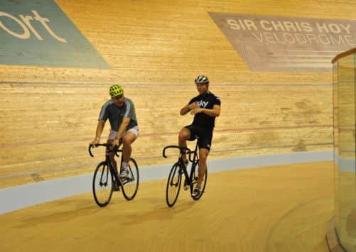 The wheel deal: Richard Bath gets some tips from multiple Olympic gold medallist Sir Chris Hoy. Picture: Robert Perry