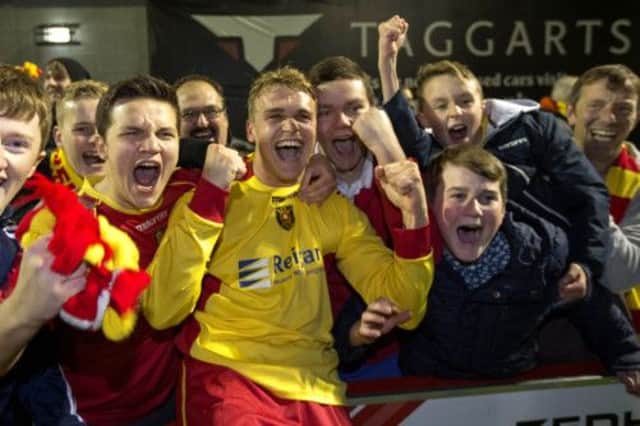Gary Phillips celebrates with fans after scoring Albion Rovers winner. Picture: PA