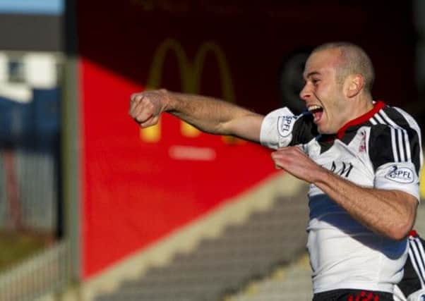 Andy Considine celebrates after his headed effort put Aberdeen ahead with four minutes played. Picture: SNS
