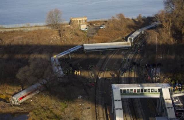 130 firefighters attended the scene of the derailment, which occurred at a sharp bend in the track. Picture: AP