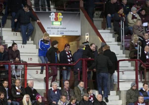 Hearts fans head for the exit before half time in their Cup game against Celtic. Picture: SNS