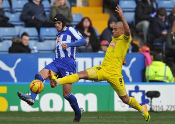 Huddersfield Town's James Vaughan, right, is a Celtic target. Picture: PA