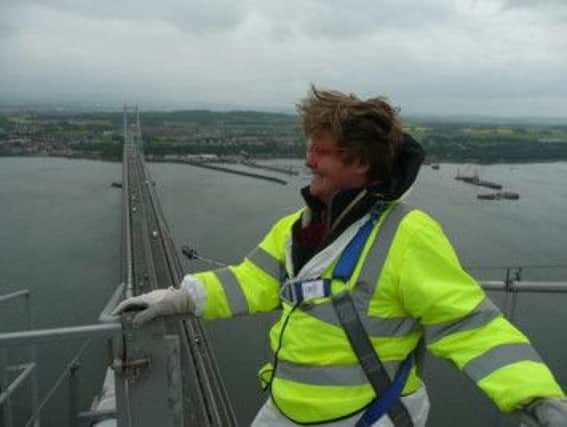 Artist Kate Downie looks out from the top of one of the towers of the Forth Road Bridge. Picture: Contributed