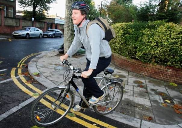 Going to work on his bicycle was an effective part of David Camerons Tory rebranding exercise. Picture: Getty