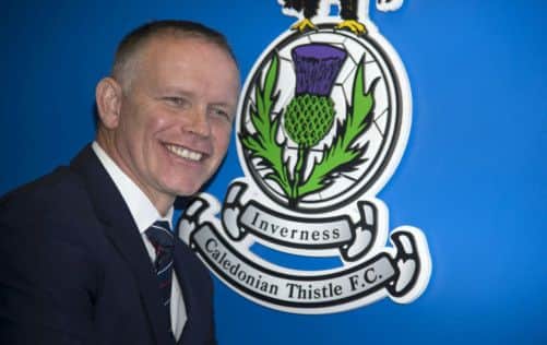 John Hughes beams for the cameras after being unveiled as Inverness Caley Thistle manager yesterday. Picture: SNS