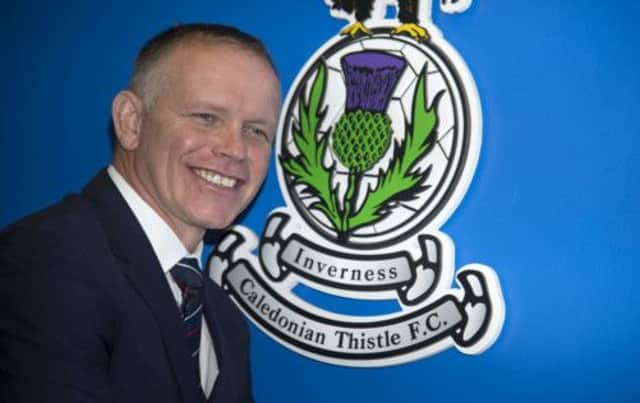 John Hughes beams for the cameras after being unveiled as Inverness Caley Thistle manager yesterday. Picture: SNS