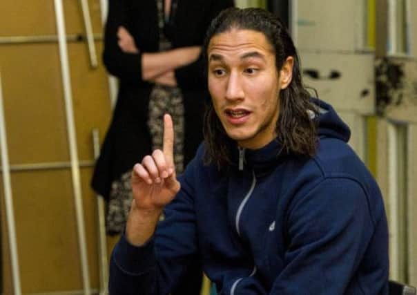 Bilel Mohsni makes a point to pupils during a visit yesterday to Lorne Street Primary School. Picture: SNS