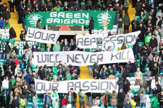 The Green Brigade display banners before a game. Picture: Ian Rutherford