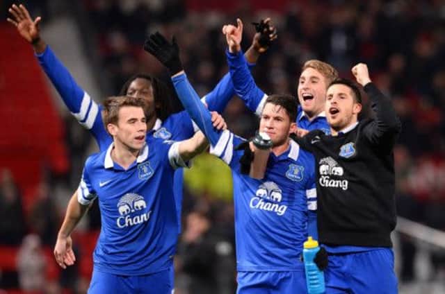 Bryan Oviedo, right with gloves, celebrates with his Everton teammates after scoring the winner. Picture: AFP/Getty