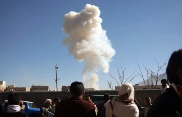 A plume of smoke rises on the skyline in Sanaa after the attack on the defence ministry compound. Picture: Getty