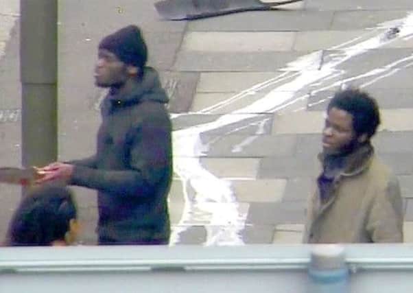 CCTV footage of Adebolajo, left, with a bloody cleaver, and Adebowale. Picture: AP