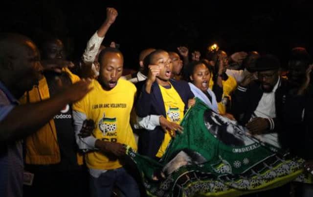 South African's sing as they pay tribute after the death of Nelson Mandela. Picture: Getty