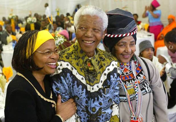 Nelson Mandela with his wife Graca Machel and ex -wife Winnie. Picture: Getty